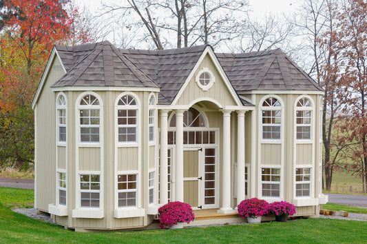 Grand Portico Mansion with flowers in front